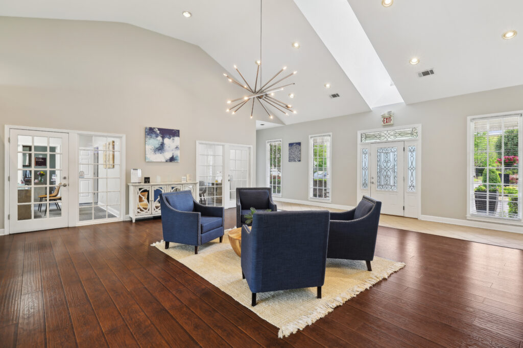 Photo of the apartment clubhouse with 4 chairs in the room