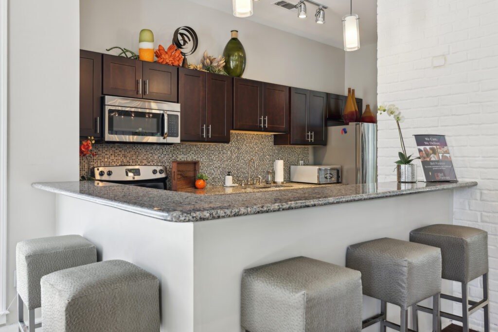 Photo of clubhouse kitchen with barstools around counter