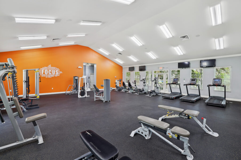 Photo of fitness center with treadmills and squat racks