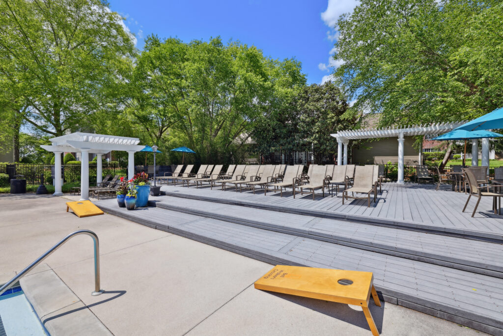 Outdoor patio with lounge chairs by the pool